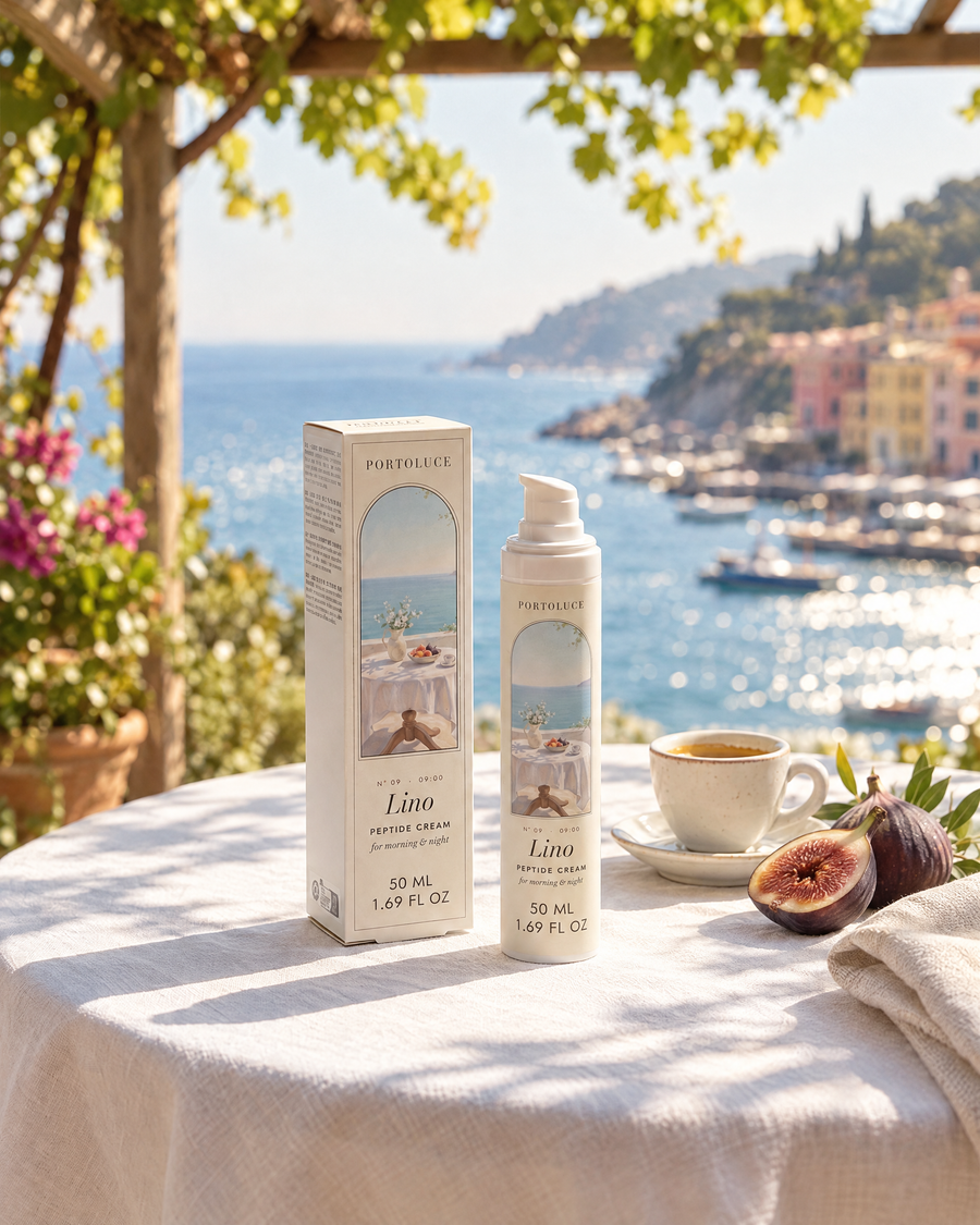 Lino Peptide AM/PM Cream and its box on a breakfast table with figs and espresso above the harbor